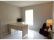 Home office with L-shaped desk and window at 9708 Little Pond Way, Tampa, FL 33647