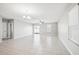 Bright living room with sliding glass doors and tile floors at 9835 Lemon Drop Loop, Sun City Center, FL 33573