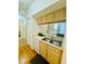 Kitchen featuring wood cabinets and double sink at 1228 S Missouri Ave # 609, Clearwater, FL 33756