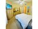 Main bedroom with a king-size bed, ceiling fan, and built-in cabinet at 1228 S Missouri Ave # 609, Clearwater, FL 33756