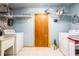 Laundry room with washer, dryer, and ample shelving at 14824 N 23Rd St, Lutz, FL 33549