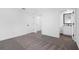 Bedroom with gray carpet and en-suite bathroom access at 29596 Fedora Cir, Brooksville, FL 34602