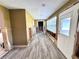 Under construction room with new wood-look floor at 311 80Th Ne Ave, St Petersburg, FL 33702