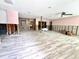 Under construction room with new wood-look floor at 311 80Th Ne Ave, St Petersburg, FL 33702