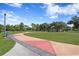 Paved pathway with geometric patterns in a park setting at 311 80Th Ne Ave, St Petersburg, FL 33702