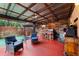 Covered patio with outdoor bar, seating, and lush landscaping at 3334 W Heiter St, Tampa, FL 33607
