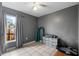 Small bedroom with dresser, window and ceiling fan at 3334 W Heiter St, Tampa, FL 33607