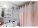 Bathroom with a sink, toilet and shower with pink curtain at 3334 W Heiter St, Tampa, FL 33607