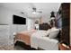 Spacious bedroom with large TV, ceiling fan and access to backyard at 3334 W Heiter St, Tampa, FL 33607