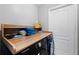 Well-lit laundry room with washer, dryer, and built-in shelving at 3334 W Heiter St, Tampa, FL 33607