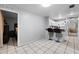 Open concept kitchen with breakfast bar and view into bedroom at 3334 W Heiter St, Tampa, FL 33607