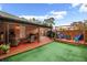 Spacious backyard with patio, deck, and grassy area at 3334 W Heiter St, Tampa, FL 33607