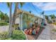 Landscaped side yard with a variety of plants and a walkway at 405 Harbor S Dr, Indian Rocks Beach, FL 33785