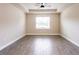 Spacious bedroom with tile flooring and large window at 411 Seasons Dr, Punta Gorda, FL 33983