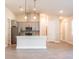 Modern kitchen with gray cabinets, quartz countertops, and stainless steel appliances at 411 Seasons Dr, Punta Gorda, FL 33983