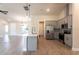 Modern kitchen with gray cabinets, quartz countertops, and stainless steel appliances at 411 Seasons Dr, Punta Gorda, FL 33983