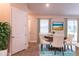 Casual dining area with a round table and four chairs near the kitchen at 411 Seasons Dr, Punta Gorda, FL 33983