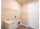 Laundry room with utility sink and shelving at 411 Seasons Dr, Punta Gorda, FL 33983