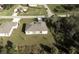 Aerial view of the property highlighting its backyard and surrounding area at 411 Seasons Dr, Punta Gorda, FL 33983