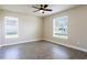 Spacious bedroom with tile floors and large windows at 411 Seasons Dr, Punta Gorda, FL 33983