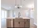 Kitchen island with sink, dishwasher, and ample counter space at 411 Seasons Dr, Punta Gorda, FL 33983