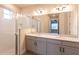 Double vanity bathroom with walk-in shower and neutral decor at 411 Seasons Dr, Punta Gorda, FL 33983