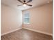 Bright bedroom with ceiling fan and tile floors at 411 Seasons Dr, Punta Gorda, FL 33983