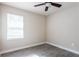 Bedroom with ceiling fan and tile floors at 411 Seasons Dr, Punta Gorda, FL 33983
