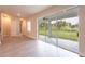 Bright dining area with sliding glass doors leading to a screened patio at 411 Seasons Dr, Punta Gorda, FL 33983