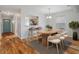 Bright dining room with hardwood floors and stylish dining set at 6126 Beechwood Dr, Dade City, FL 33523