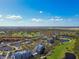 Aerial view of community near golf course and water at 2333 Feather Sound Dr # A509, Clearwater, FL 33762