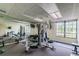 Fitness center with weight machines and a large mirror at 2333 Feather Sound Dr # A509, Clearwater, FL 33762