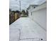 Long driveway with parking space alongside the exterior of the property at 301 W Chelsea St, Tampa, FL 33603