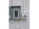 Exterior shot of a breaker box and electric meter on stucco wall at 301 W Chelsea St, Tampa, FL 33603