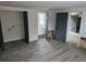 Spacious open room with new flooring leading to a bathroom and other rooms at 301 W Chelsea St, Tampa, FL 33603