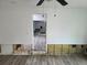 Open living room with view to the kitchen boasts of new flooring at 301 W Chelsea St, Tampa, FL 33603