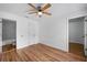 Light and airy bedroom with wood flooring and ceiling fan at 3330 W Heiter St, Tampa, FL 33607