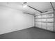 Garage with gray epoxy flooring and an automatic garage door opener at 3330 W Heiter St, Tampa, FL 33607
