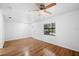 Living room featuring wood floors and a ceiling fan at 3330 W Heiter St, Tampa, FL 33607