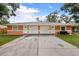 Two-unit building with attached garages at 3330 W Heiter St, Tampa, FL 33607