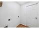 Simple laundry room with washer and dryer hookups, and wood-look floors at 3330 W Heiter St, Tampa, FL 33607