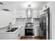 Modern kitchen featuring stainless steel appliances and white shaker cabinets at 3330 W Heiter St, Tampa, FL 33607