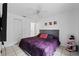 Spacious bedroom with a king-size bed and ceiling fan at 3336 W Heiter St, Tampa, FL 33607
