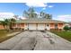 Orange duplex with a three car garage at 3336 W Heiter St, Tampa, FL 33607