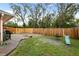 Large backyard with a wooden fence and play area at 3336 W Heiter St, Tampa, FL 33607