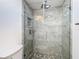 Modern shower with glass enclosure and marble-look tile at 4105 W Carmen St, Tampa, FL 33609