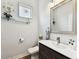 Elegant powder room with modern vanity and fixtures at 4516 Bay Spring Ct, Tampa, FL 33611