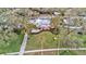 Aerial view showing home, landscaping, and walkway at 518 Riverside Dr, Tarpon Springs, FL 34689