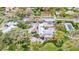 Aerial view of a home with pool and large lot at 518 Riverside Dr, Tarpon Springs, FL 34689