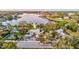 Aerial view of a waterfront home and surrounding neighborhood at 518 Riverside Dr, Tarpon Springs, FL 34689